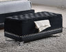 Black Barzini velvet upholstered tufted storage bench, CoasterElevations furniture with cushioned top and tufted detailing.