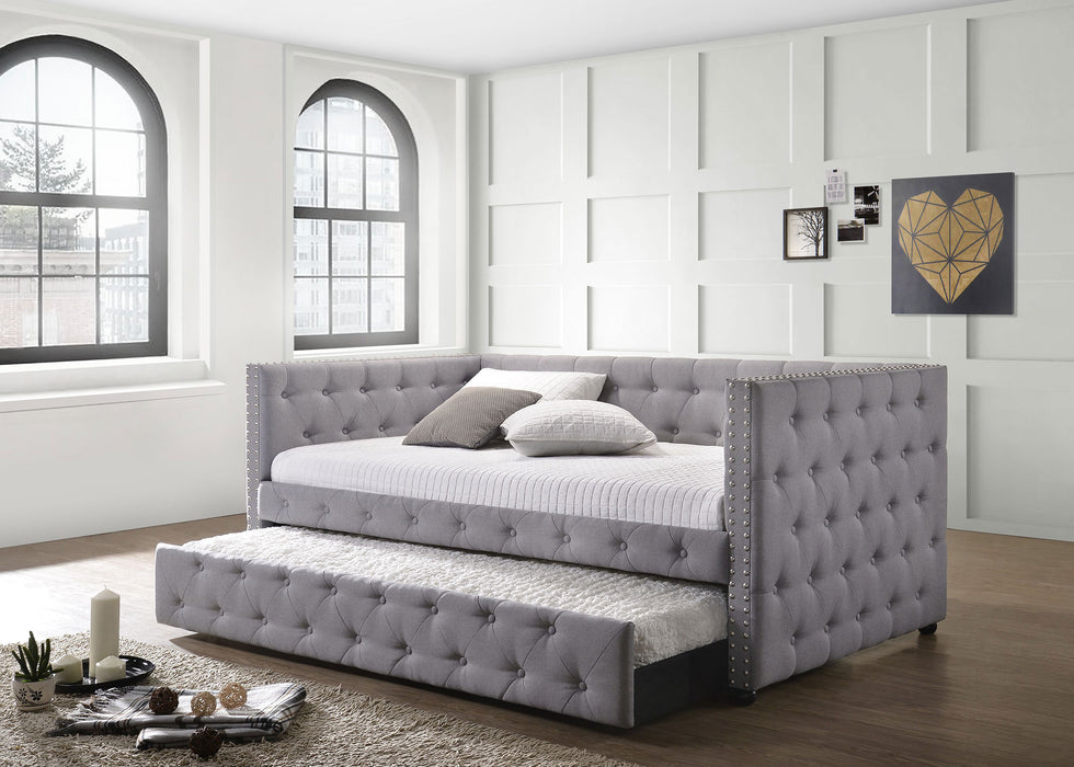 CoasterEssence Mockern upholstered twin daybed with grey fabric, includes a trundle and wooden legs, ideal for a modern bedroom.