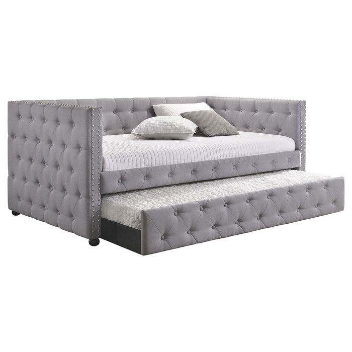 CoasterEssence Mockern Grey upholstered twin daybed with built-in trundle, featuring a padded headboard and modern furniture design.