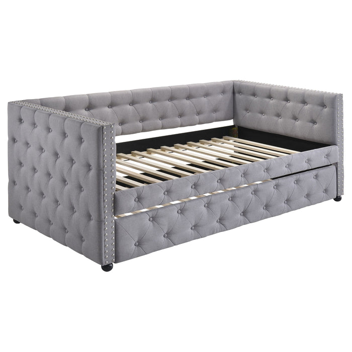 Mockern upholstered twin daybed with trundle in grey, CoasterEssence furniture, showcasing fabric upholstery and modern design.