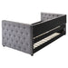CoasterEssence Mockern upholstered twin daybed with trundle in grey fabric, featuring a modern design and plush cushioning.