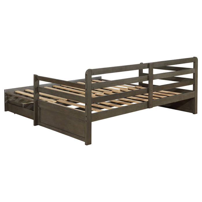 Grey Sorrento twin XL daybed with two drawers and extension trundle, made by CoasterEssence, shown with mattress and bedding.