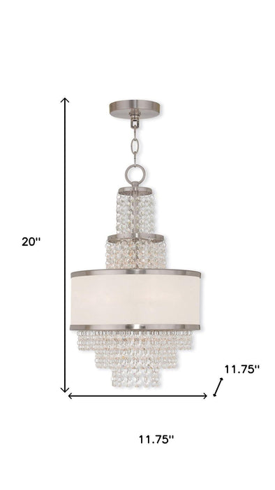 HomeRoots 20-inch metal chandelier with three lights, clear shades, and dimmable feature in nickel finish.