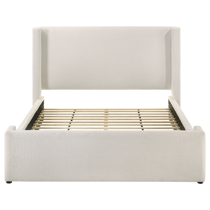 White Alamosa Boucle Upholstered Queen Wingback Bed with tufted headboard and wooden legs, in a modern bedroom setting.