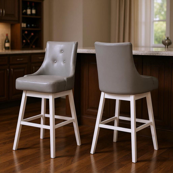 Set of two HomeRoots 29-inch gray and white faux leather and solid wood swivel bar chairs with high backs and modern design.