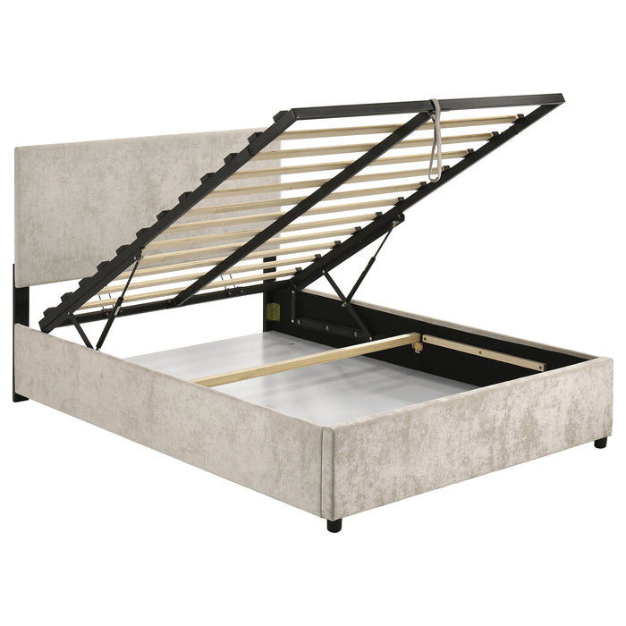 Beige upholstered CoasterEveryday Reeves full lift-top storage platform bed with padded headboard and built-in storage drawers.
