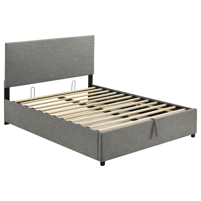 Grey Reeves upholstered full lift-top storage platform bed by CoasterEveryday, showing the bed's upholstered headboard and lift mechanism.