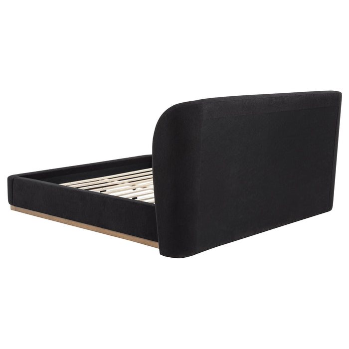 Black Blaire upholstered California King wingback platform bed from CoasterEveryday, with tall wingback headboard and sleek design.