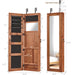 Giga jewelry armoire organizer with full-length mirror, wall-mounted lockable cabinet and built-in LED light, displaying jewelry storage.