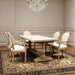 Set of two Giga French vintage upholstered fabric dining armchairs with elegant armrests and classic design.