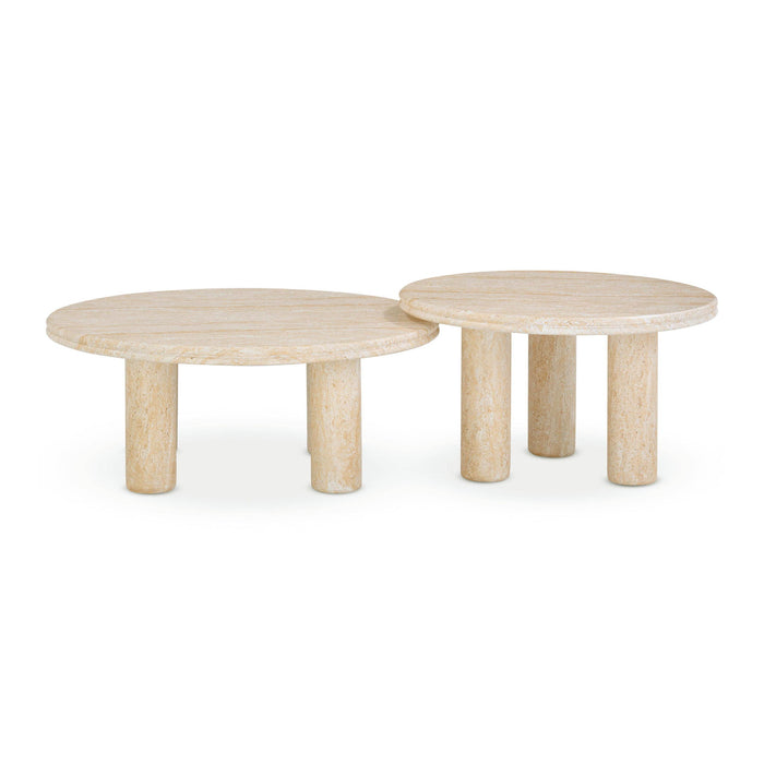 Set of two TOV Furniture Amora indoor outdoor nesting accent tables with travertine tops and sleek metal legs.