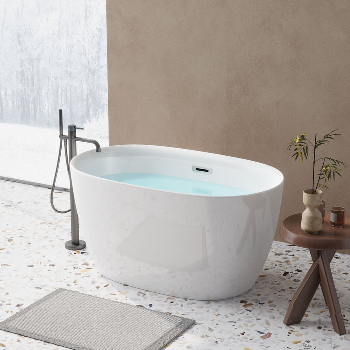 Giga freestanding oval bathtub in gloss white with overflow and pop-up drain, double-walled design, sleek and modern bathroom fixture.