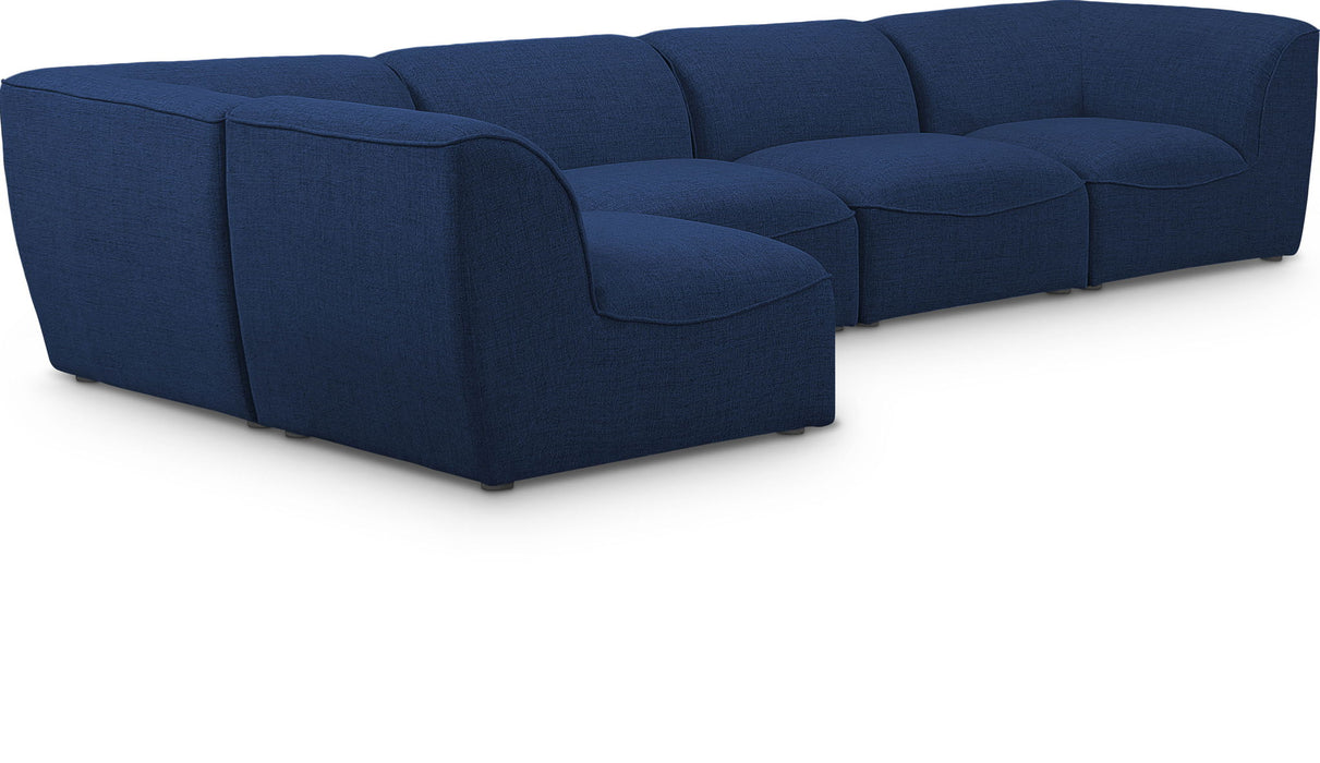 Miramar Meridian Furniture 5-piece modular sectional sofa with plush cushions and modern design, arranged in a spacious living room setting.