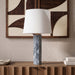 Linen textured fabric table lamp from Meridian Furniture with a sleek, modern design and neutral color for home decor.