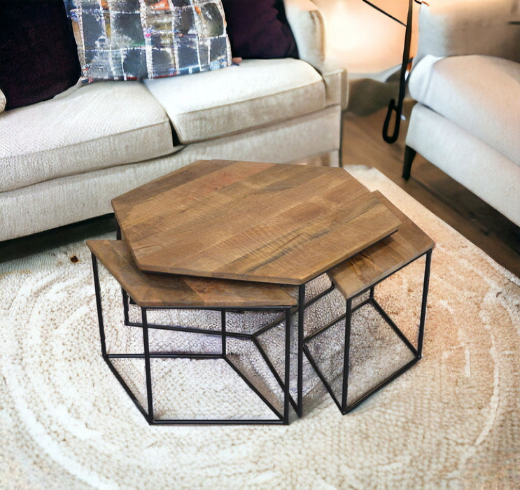 Set of four HomeRoots geometric wooden nesting coffee tables with brown and black finish, featuring modern angular design.