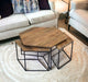 Set of four HomeRoots geometric wooden nesting coffee tables with brown and black finish, featuring modern angular design.