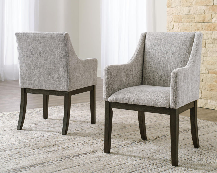 Set of two Ashley Furniture dining UPH arm chairs in beige and dark brown fabric with wooden legs.