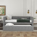 Gray upholstered twin size daybed with trundle, padded back and sides, by Giga, featuring a sleek, modern design.