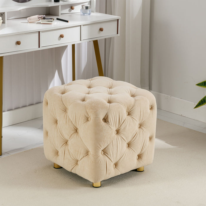 Giga upholstered ottoman with soft fabric, serving as a small end table or footstool in living room or bedroom decor.