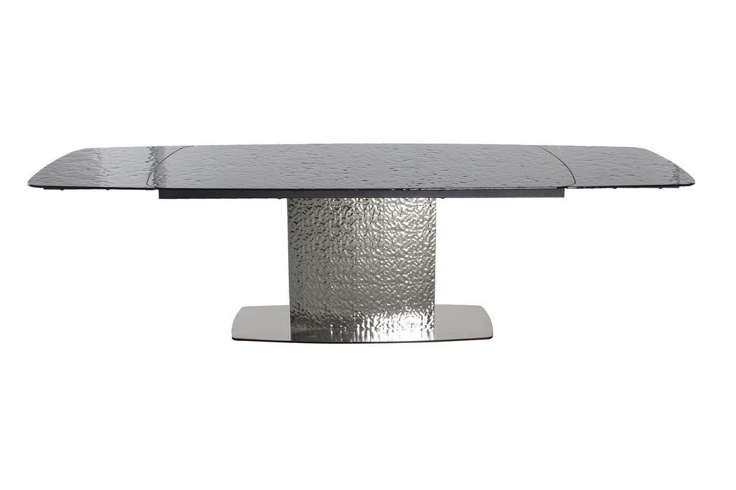 Contemporary black extendable dining table by Chintaly with textured glass top and stainless steel base, perfect for modern dining spaces.