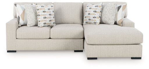 Benchcraft Laurelgrove 2-piece stationary sectional sofa set with plush cushions and modern design, shown in a living room setting.