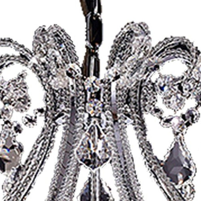 HomeRoots Empire eight-light chandelier with transparent glass candle-style fixtures in nickel finish and ivory accents.