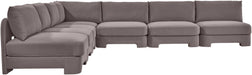 Velvet performance fabric upholstered Meridian Furniture 7-piece armless sectional sofa in a stationary living room setup.