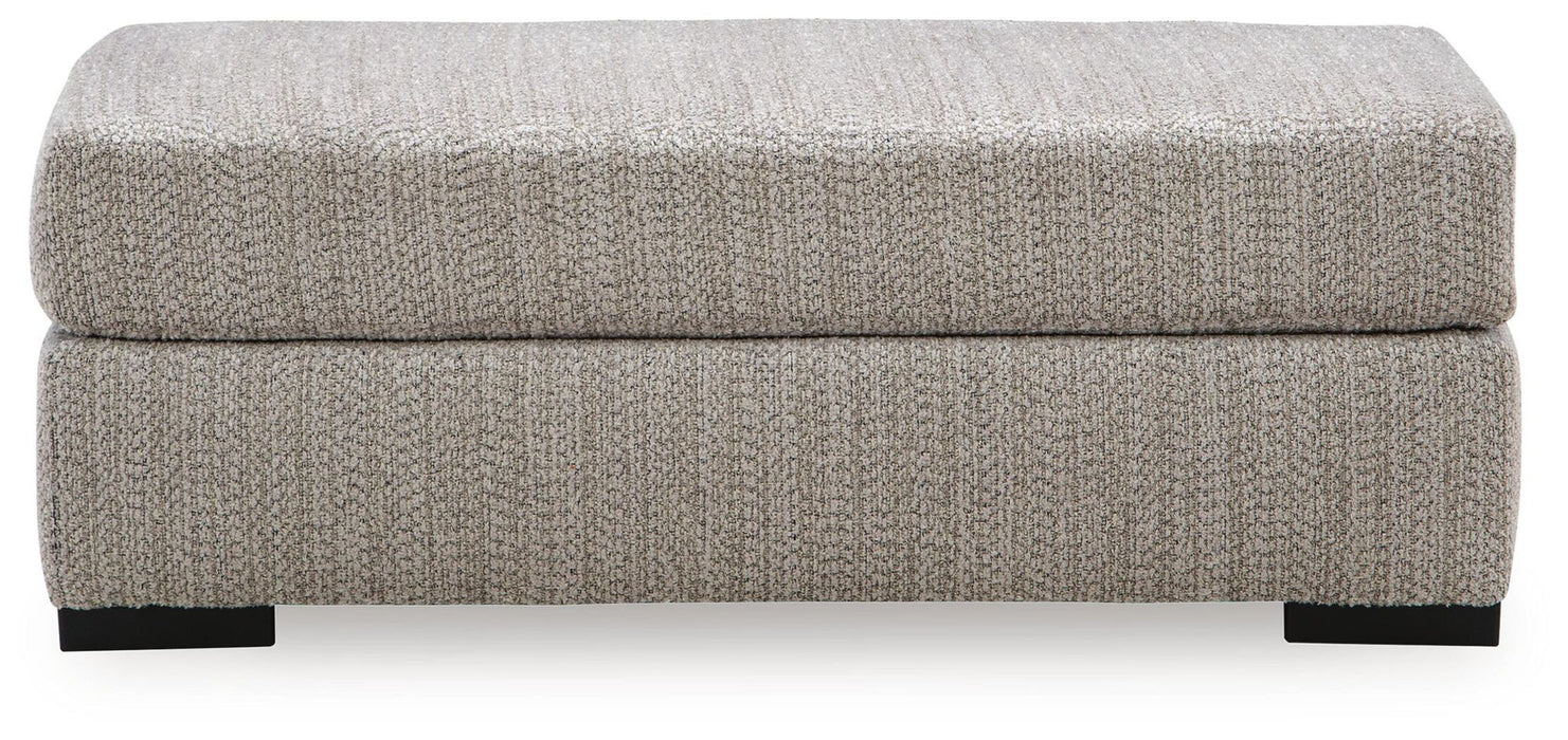 Upholstered Lofwood Ottoman by Signature Design Ashley® with soft fabric and wooden legs, modern style for living room decor.