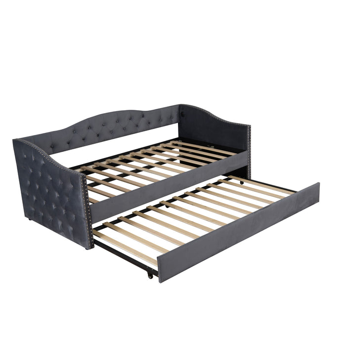 Gray Giga twin size upholstered daybed with trundle and USB charging ports, ideal for modern bedroom decor.