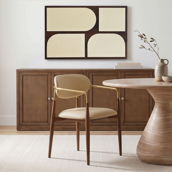 Vegan leather upholstered Meridian Furniture Ronda dining arm chair with walnut wood legs and cushioned seat and backrest.
