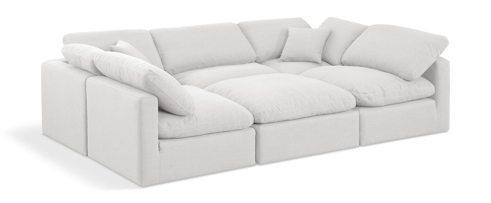 White linen Meridian Furniture Indulge 6-piece modular sectional sofa with stationary design, shown in a modern living room setting.