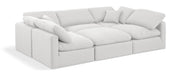White linen Meridian Furniture Indulge 6-piece modular sectional sofa with stationary design, shown in a modern living room setting.
