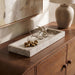 Michael Meridian Furniture travertine tray with rounded edges and natural stone finish, ideal for serving or decorative display.