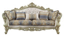 Velvet curved floral sofa with champagne legs and matching toss pillows in antiqued white, styled as a stationary sofa by HomeRoots.