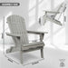 Set of two Giga wooden outdoor Adirondack lounge chairs with folding design, made of solid cedar wood for garden patio relaxation.