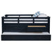 Wood twin captain's bed with trundle in navy blue, featuring a sturdy frame and built-in storage drawers, by CoasterEveryday.