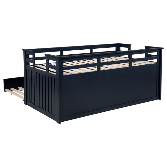 CoasterEveryday Carlsbad twin captain's bed in navy blue wood with built-in trundle and storage drawers, ideal for children's bedroom.