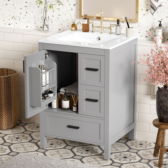 Gray Giga bathroom vanity with sink, soft-close doors, double-layer shelf, and three drawers for stylish bathroom storage.