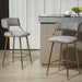 Set of two Giga counter height bar stools with powder-coated bases, footrests, and sleek modern design, perfect for kitchen or bar area.