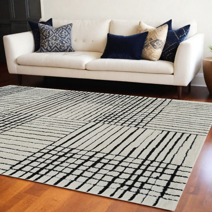 8' x 11' Modern Abstract Distressed Polypropylene Area Rug - Cream And Black