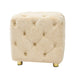 Giga modern upholstered ottoman with soft fabric, serving as a small end table, foot stool, or dressing chair in living rooms or bedrooms.