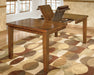 Signature Design by Ashley Ralene dining room counter table with a sleek wooden surface and sturdy legs.