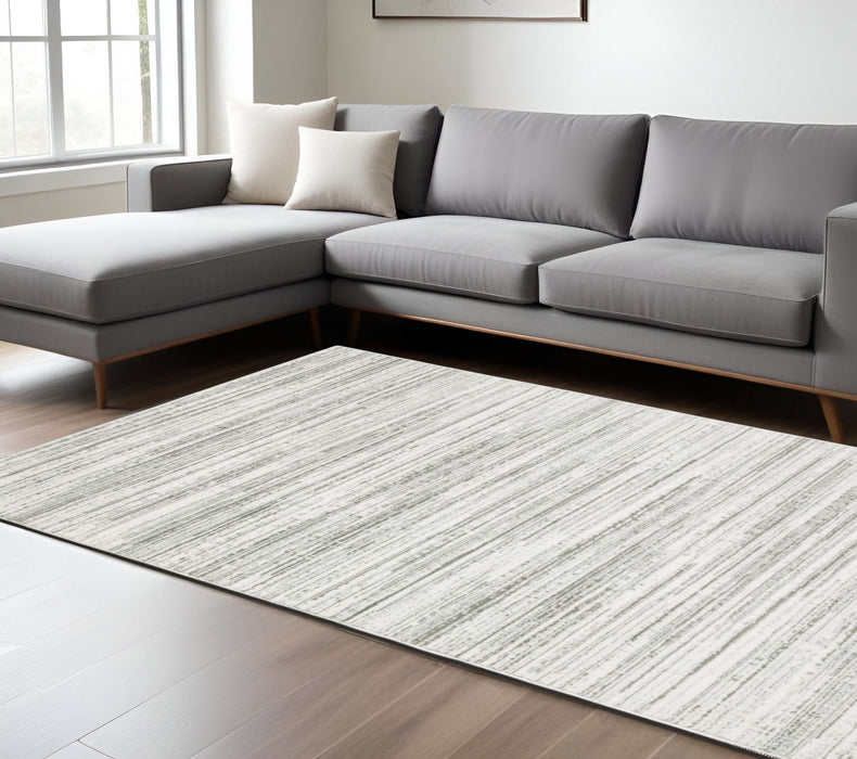 6.6' x 9.7' Abstract Power Loom Area Rug - Gray And White