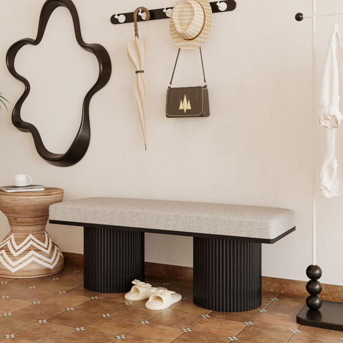 Light gray upholstered bench with black chunky legs by Giga, featuring contemporary boucle fabric, ideal for bedroom or living room.