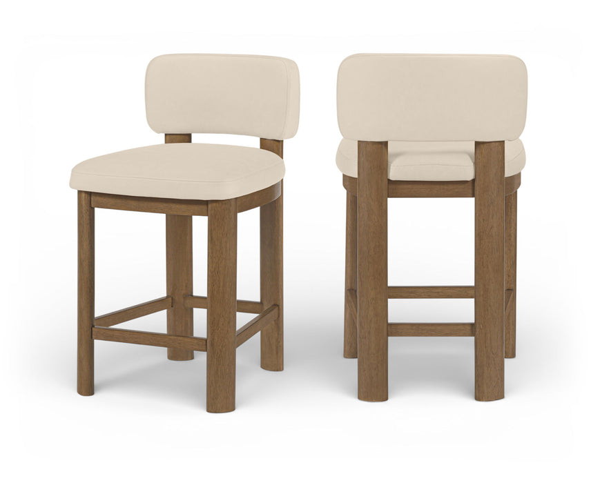 Set of two Meridian Furniture Paloma faux leather counter stools with brown frames and upholstered seats.