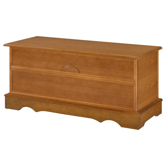 CoasterEssence Paula cedar chest in honey finish, featuring a classic wooden storage design