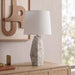 Seraphine marble and linen textured fabric table lamp by Meridian Furniture with a sleek, modern design and neutral tones.