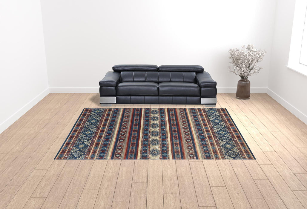 10' x 13' Geometric Power Loom Distressed Stain Resistant Area Rug - Blue Red And Ivory