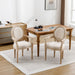 Set of two Giga French vintage upholstered fabric dining armchairs with classic design and cushioned seats.
