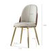 Set of two Giga modern beige dining chairs with gold metal legs, stylish and comfortable for contemporary dining spaces.